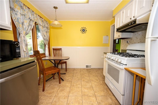 150 Collins Ave, West Seneca, NY 14224 - kitchen featuring white appliances, white cabinets, decorative backsplash, pendant lighting, and a wainscoted wall