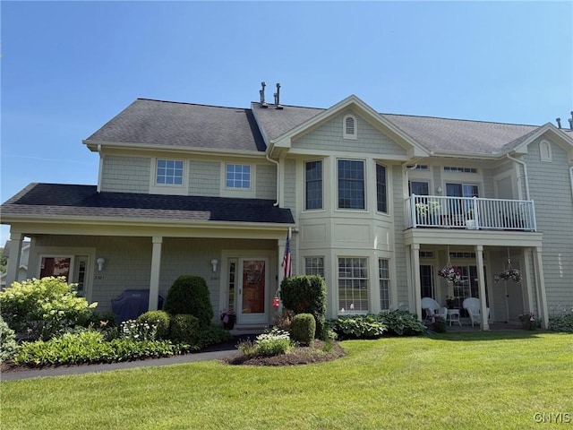 2301 Greymoor Way, Lysander, NY 13027 - view of front facade with a front yard, roof with shingles, and a balcony