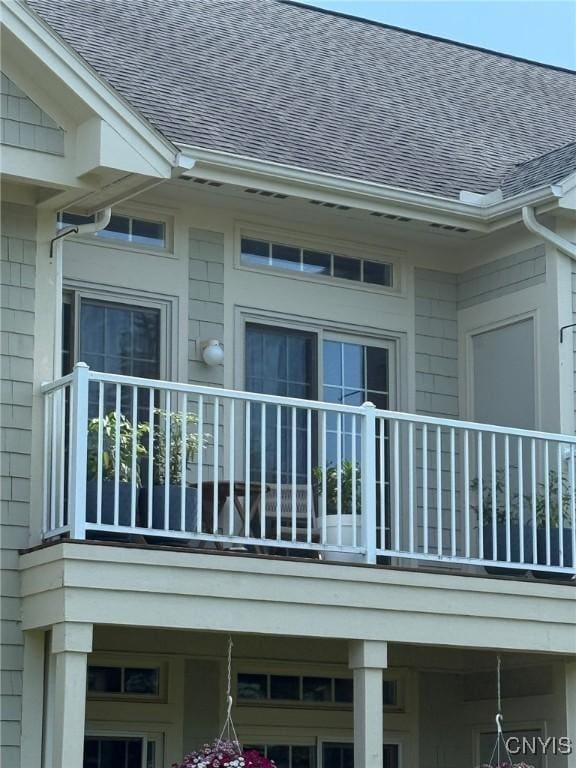 2301 Greymoor Way, Lysander, NY 13027 - view of property exterior featuring a shingled roof and a balcony