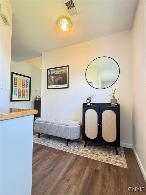 2301 Greymoor Way, Lysander, NY 13027 - hallway with dark wood-style flooring and baseboards