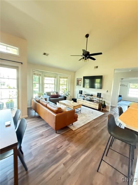 2301 Greymoor Way, Lysander, NY 13027 - living area with a ceiling fan, wood finished floors, and high vaulted ceiling