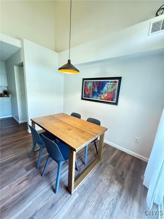 2301 Greymoor Way, Lysander, NY 13027 - dining area featuring dark wood finished floors and baseboards