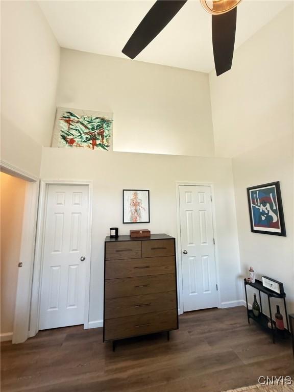 2301 Greymoor Way, Lysander, NY 13027 - bedroom featuring a towering ceiling and dark wood finished floors