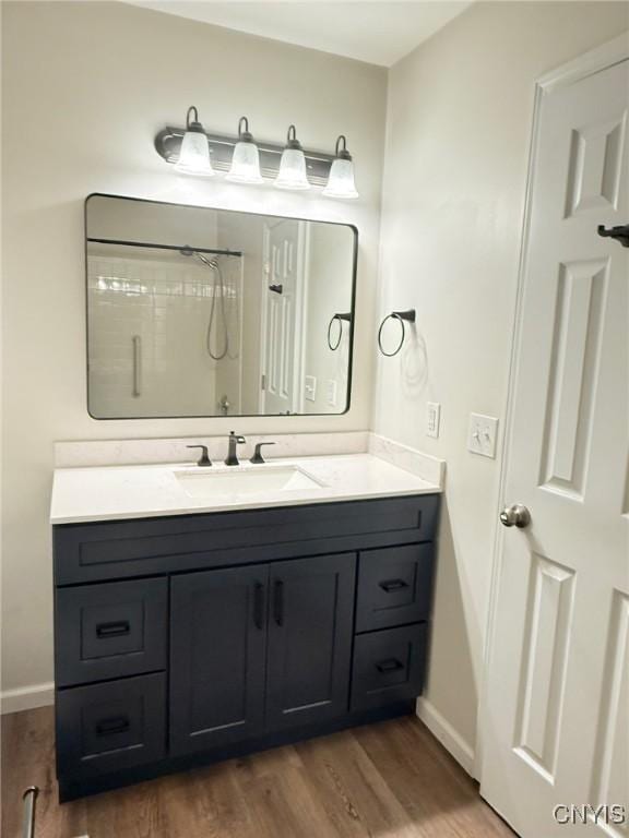2301 Greymoor Way, Lysander, NY 13027 - bathroom with vanity, wood finished floors, and a shower
