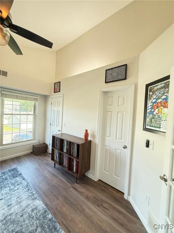 2301 Greymoor Way, Lysander, NY 13027 - living area featuring wood finished floors, vaulted ceiling, and ceiling fan
