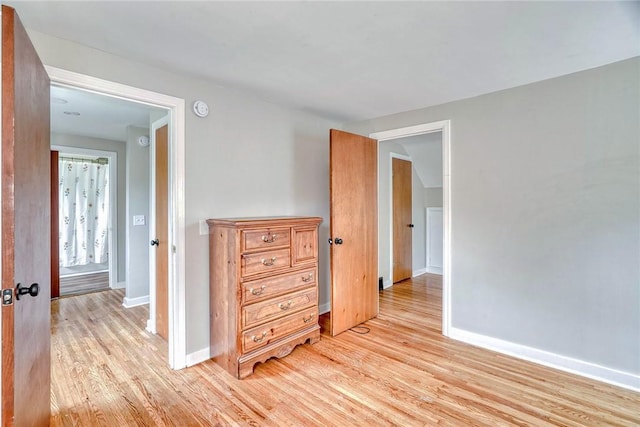 2862 Culver Rd, Irondequoit, NY 14622 - empty room with light wood finished floors and a smoke detector