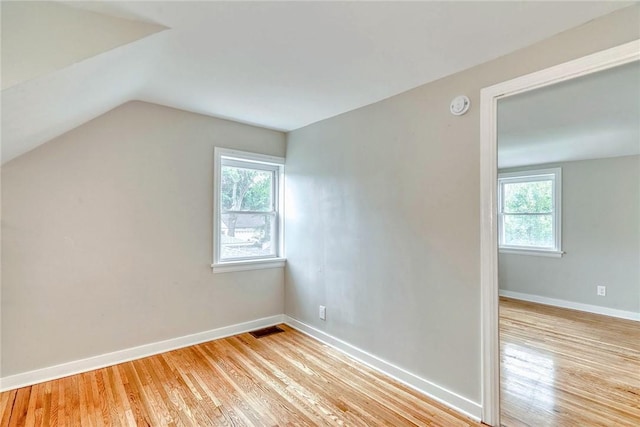 2862 Culver Rd, Irondequoit, NY 14622 - additional living space with light wood-style flooring and vaulted ceiling