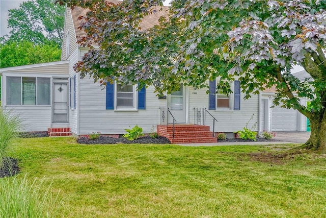 2862 Culver Rd, Irondequoit, NY 14622 - view of front of house with a front lawn, an attached garage, asphalt driveway, and entry steps