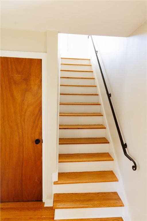 2862 Culver Rd, Irondequoit, NY 14622 - stairs featuring wood finished floors