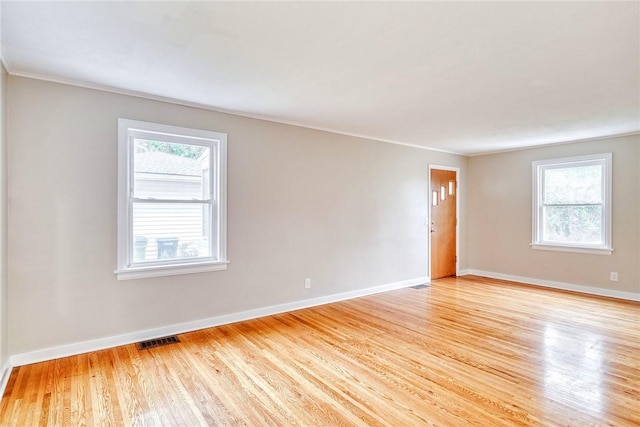 2862 Culver Rd, Irondequoit, NY 14622 - spare room with light wood-type flooring, healthy amount of natural light, and ornamental molding