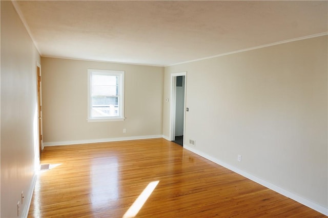 2862 Culver Rd, Irondequoit, NY 14622 - empty room featuring light wood-style flooring and crown molding