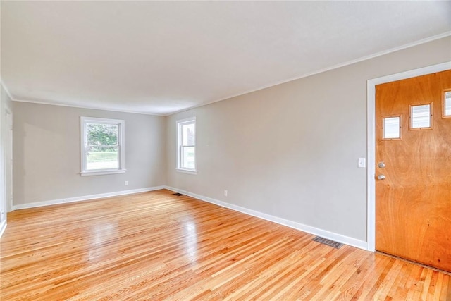 2862 Culver Rd, Irondequoit, NY 14622 - empty room featuring light wood-type flooring and crown molding