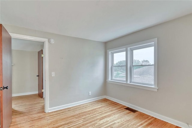 2862 Culver Rd, Irondequoit, NY 14622 - empty room featuring light wood-type flooring and a smoke detector
