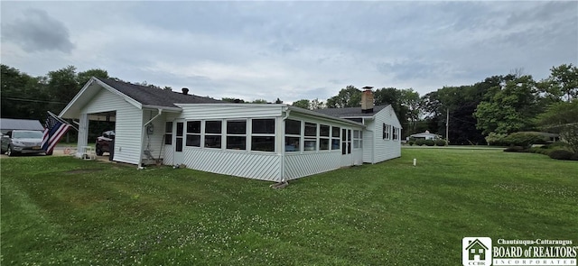1710 Haskell Pkwy, Portville, NY 14760 - view of home's exterior featuring a lawn, a garage, and a chimney
