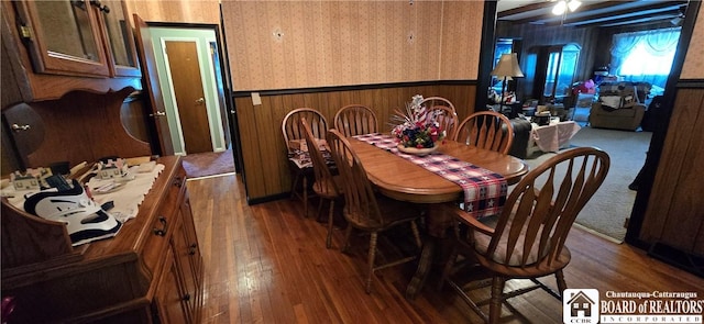 1710 Haskell Pkwy, Portville, NY 14760 - dining room featuring wainscoting, wallpapered walls, hardwood / wood-style floors, and wooden walls