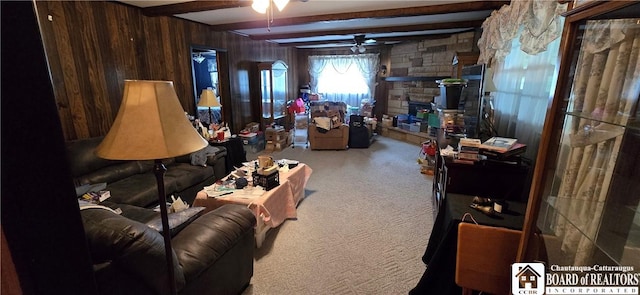 1710 Haskell Pkwy, Portville, NY 14760 - carpeted living room featuring a ceiling fan, beam ceiling, and wooden walls