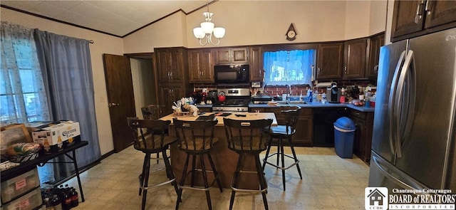 1710 Haskell Pkwy, Portville, NY 14760 - kitchen featuring stainless steel appliances, light floors, lofted ceiling, dark brown cabinetry, and tasteful backsplash