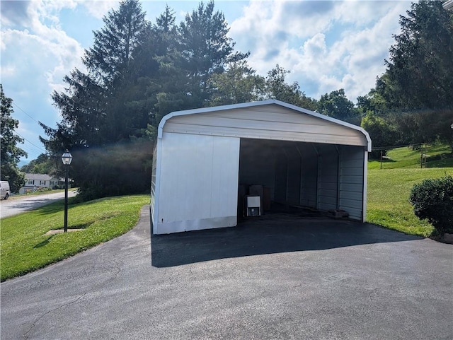 310 E Green St, Smethport Boro, PA 16749 - garage featuring a carport and driveway