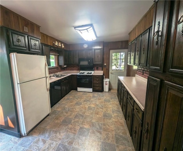 310 E Green St, Smethport Boro, PA 16749 - kitchen featuring black appliances, light countertops, stone finish floors, and backsplash