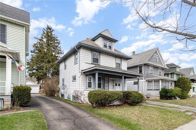 430 Ridgeway Ave, Rochester, NY 14615 - american foursquare style home with an outbuilding, a garage, a front yard, and a shingled roof