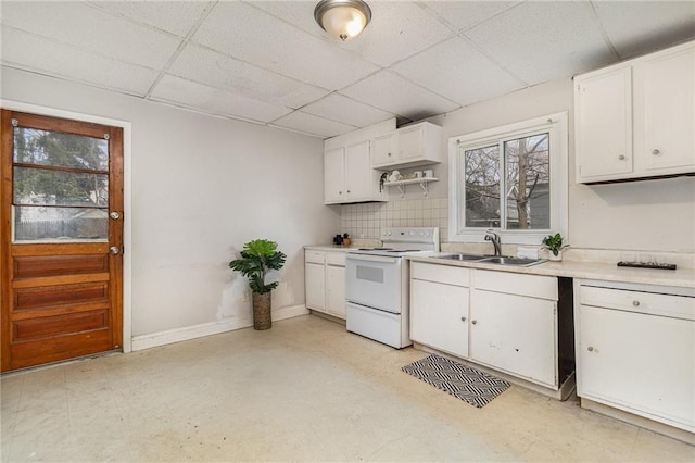 430 Ridgeway Ave, Rochester, NY 14615 - kitchen with white range with electric stovetop, a paneled ceiling, plenty of natural light, and white cabinetry