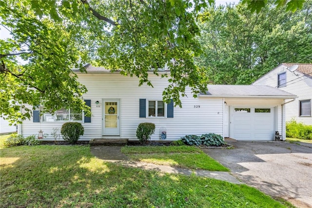 529 Fetzner Rd, Greece, NY 14626 - view of front of house with a garage, asphalt driveway, and a front yard