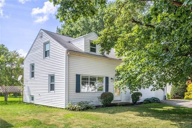 529 Fetzner Rd, Greece, NY 14626 - view of front of property featuring driveway and a garage