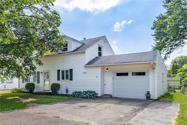 529 Fetzner Rd, Greece, NY 14626 - view of front of house featuring an attached garage, asphalt driveway, and roof with shingles
