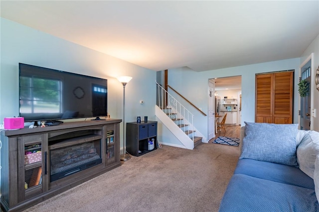 529 Fetzner Rd, Greece, NY 14626 - carpeted living room with stairway and a fireplace