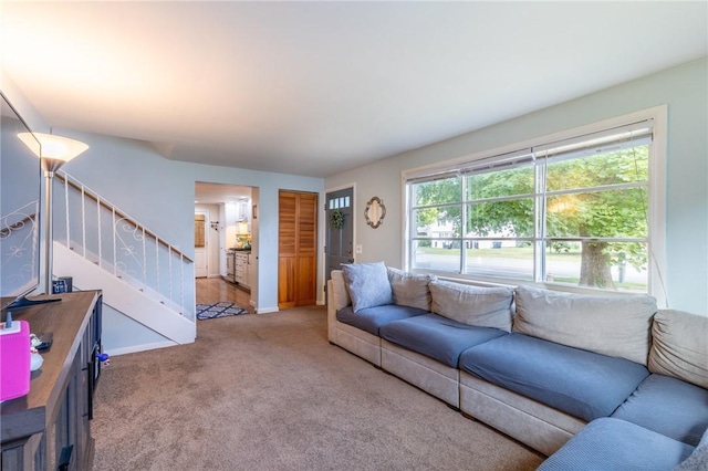 529 Fetzner Rd, Greece, NY 14626 - carpeted living area featuring stairway and baseboards