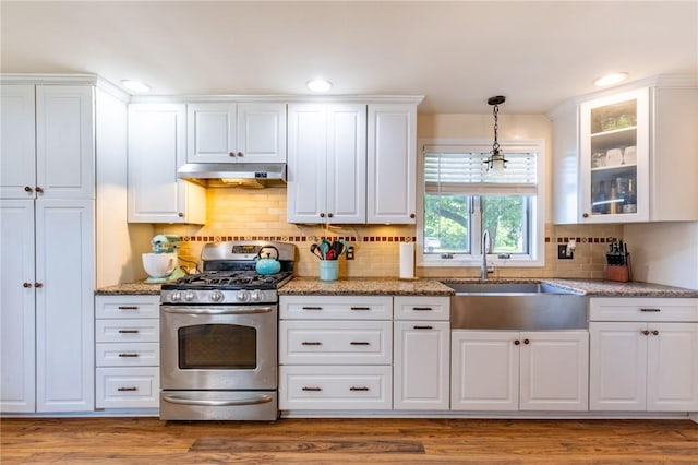 529 Fetzner Rd, Greece, NY 14626 - kitchen featuring stainless steel gas range oven, under cabinet range hood, white cabinetry, glass insert cabinets, and recessed lighting