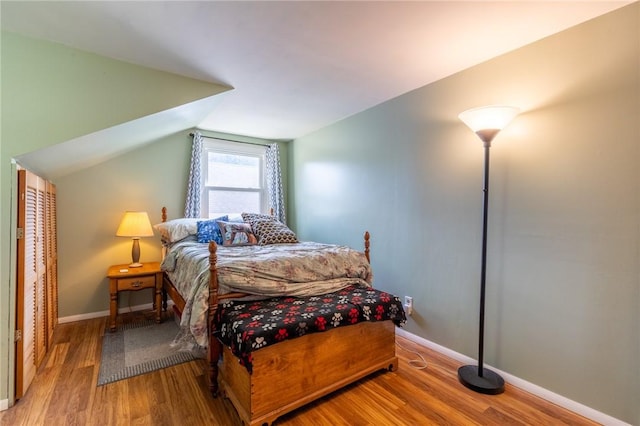 529 Fetzner Rd, Greece, NY 14626 - bedroom featuring wood finished floors and vaulted ceiling