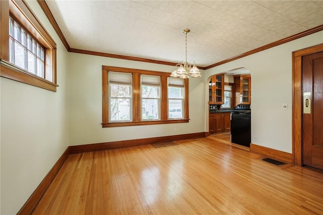 1043 Genesee Park Blvd, Rochester, NY 14619 - unfurnished dining area with light wood-type flooring, arched walkways, a chandelier, and ornamental molding