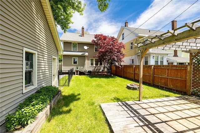 1043 Genesee Park Blvd, Rochester, NY 14619 - fenced backyard with a fire pit
