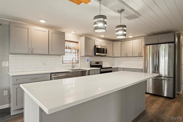 5640 Fearon Rd, Eaton, NY 13408 - kitchen featuring appliances with stainless steel finishes, gray cabinetry, dark wood-style flooring, tasteful backsplash, and recessed lighting