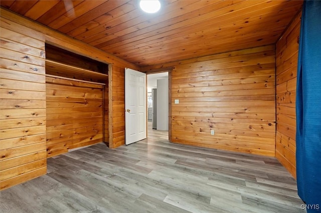 5640 Fearon Rd, Eaton, NY 13408 - unfurnished bedroom featuring wood ceiling, wood walls, wood finished floors, and a closet