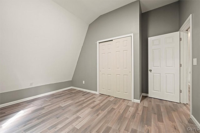 5640 Fearon Rd, Eaton, NY 13408 - unfurnished bedroom featuring vaulted ceiling, wood finished floors, and a closet
