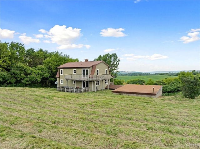 5640 Fearon Rd, Eaton, NY 13408 - back of property featuring a wooden deck, a chimney, and a yard