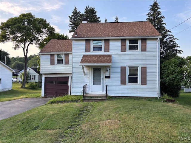 39 Standart Ave, Auburn, NY 13021 - view of front of home featuring a garage, driveway, a front yard, and a chimney