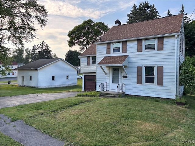 39 Standart Ave, Auburn, NY 13021 - view of front of house with a chimney, a front lawn, driveway, and a shingled roof