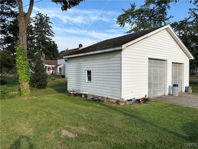 39 Standart Ave, Auburn, NY 13021 - view of side of property with a detached garage, an outdoor structure, and a lawn