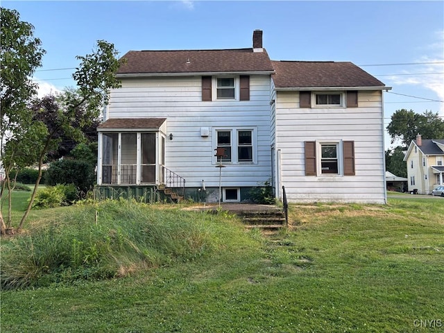 39 Standart Ave, Auburn, NY 13021 - back of house featuring a sunroom, a chimney, a lawn, and a shingled roof