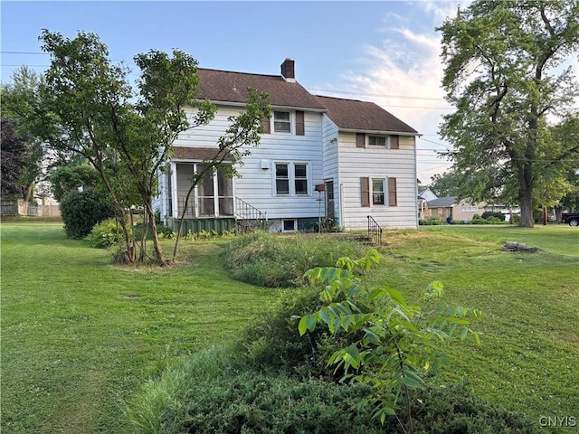 39 Standart Ave, Auburn, NY 13021 - back of house featuring a yard and a chimney