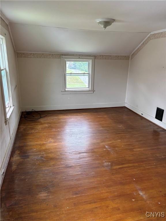 39 Standart Ave, Auburn, NY 13021 - spare room featuring wood finished floors and vaulted ceiling