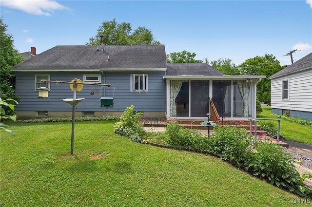 7165 Manlius Center Rd, Manlius, NY 13057 - rear view of property with a sunroom, a yard, and roof with shingles