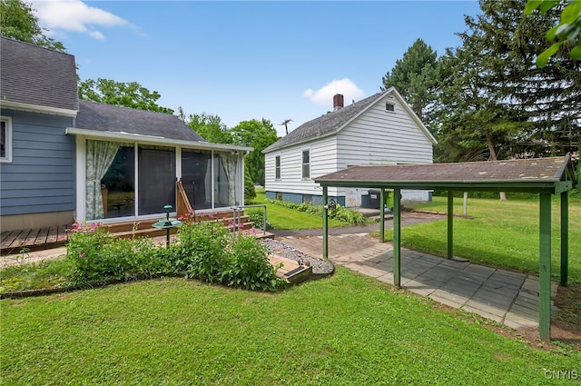 7165 Manlius Center Rd, Manlius, NY 13057 - view of green lawn featuring a sunroom