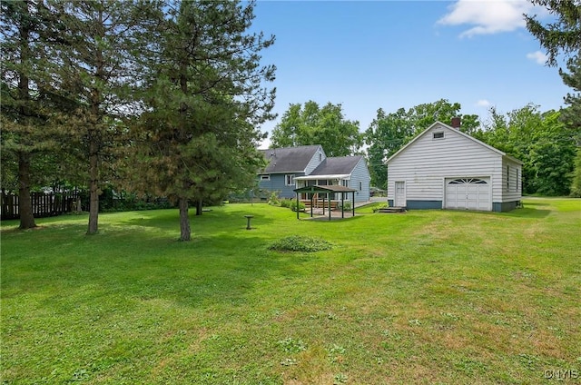 7165 Manlius Center Rd, Manlius, NY 13057 - view of grassy yard with an outdoor structure and a garage