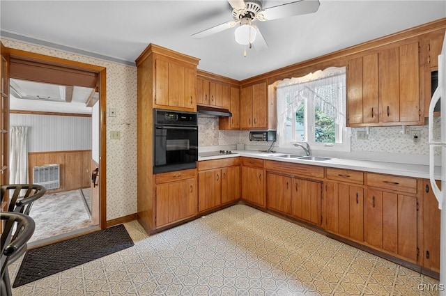 7165 Manlius Center Rd, Manlius, NY 13057 - kitchen featuring wallpapered walls, black appliances, light countertops, ceiling fan, and brown cabinets