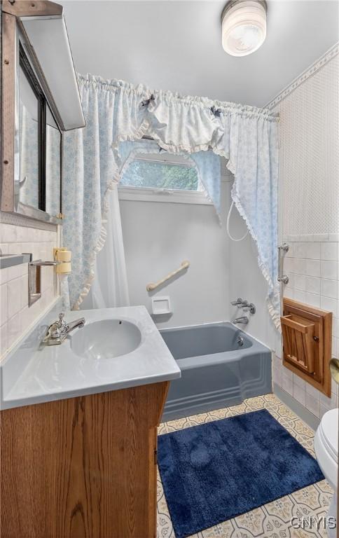 7165 Manlius Center Rd, Manlius, NY 13057 - bathroom featuring vanity, shower / bath combo, and tile patterned flooring
