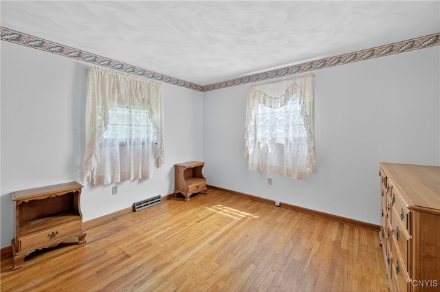 7165 Manlius Center Rd, Manlius, NY 13057 - spare room with plenty of natural light and wood finished floors
